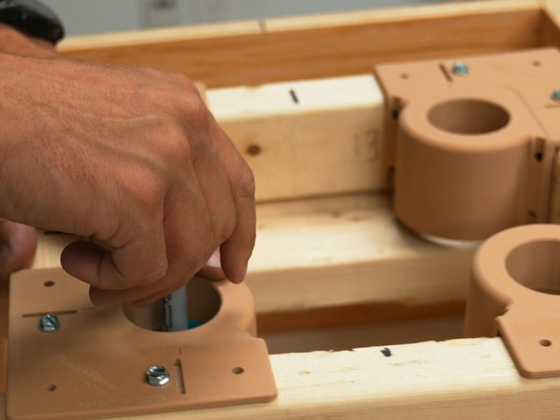 Marking drilling spots through the marking adapters of a 2x3 template inside prebuilt formwork